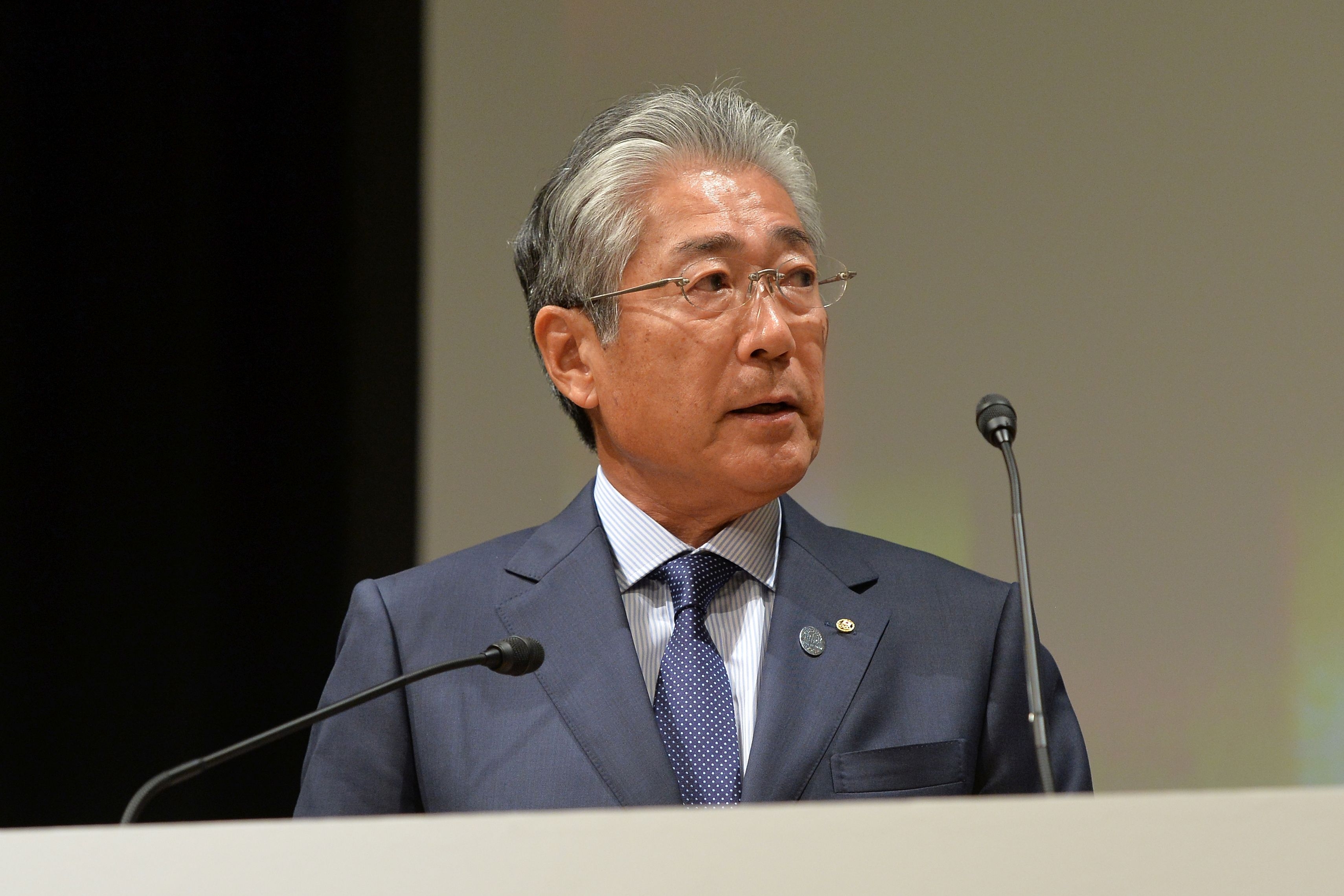 Президентът на Олимпийския комитет на Япония Цунекадзу Такеда срещу когото