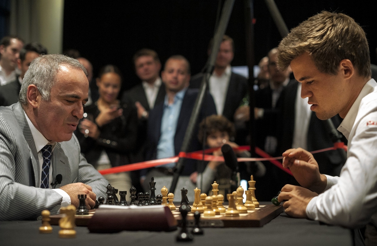 Шахматы чемпионаты турниры. Магнус Карлсен и Каспаров.